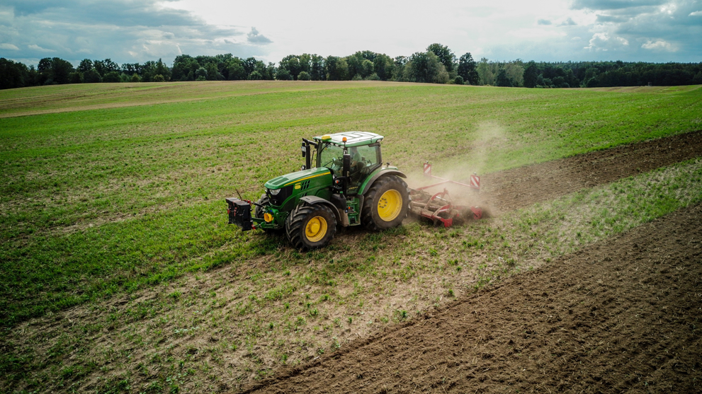 Utility Tractor Preparing Field For Mulching