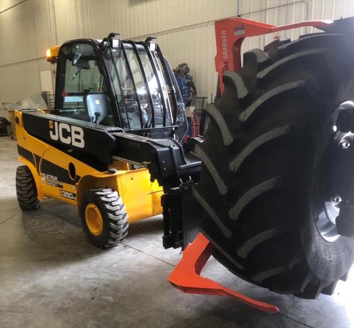 The Tire Grabber Tire Handler | Model TG4000 | Width 83" | Capacity 4000 lb | 10 To 20 GPM | 40 To 100 HP | For Skid Steer, Tractor & Loader