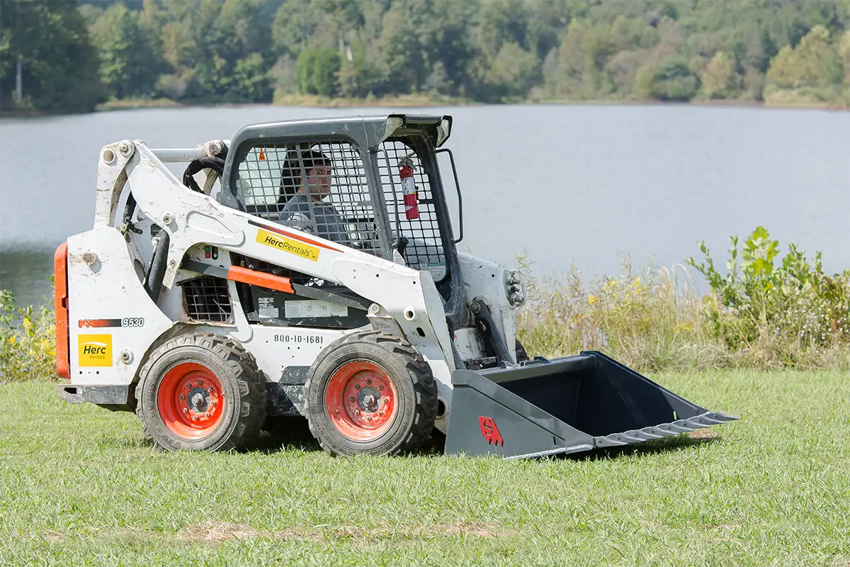 Solesbee’s Tooth Bucket | Model SSLB-T Series | Widths 66" – 84" | 8–30+ GPM | For Skid Steers