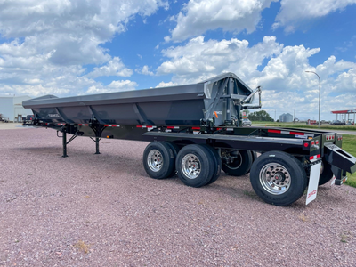 Demco | Triple Axle Side Dump Trailer | Model Length 34' | Capacity 22.7 Cubic Yards | Weight 17,000 lbs | Horsepower 350–400 HP | For Tractor